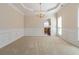 Dining room features chair rail, decorative lighting, and view to the kitchen at 7325 Thoreau Cir, Atlanta, GA 30349