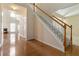 Spacious foyer boasting hardwood floors, a staircase, and access to multiple living areas at 7325 Thoreau Cir, Atlanta, GA 30349