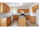 Functional kitchen with wooden cabinets and tiled backsplash at 7325 Thoreau Cir, Atlanta, GA 30349