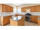 Well-lit kitchen with an island and stainless steel appliances at 7325 Thoreau Cir, Atlanta, GA 30349