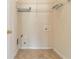 Small laundry room with tile flooring, white wire shelving, and basic hookups at 7325 Thoreau Cir, Atlanta, GA 30349