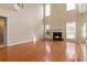 Bright living room features hardwood floors, fireplace, many windows and high ceilings at 7325 Thoreau Cir, Atlanta, GA 30349