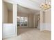 Spacious living room featuring chair rail, decorative lighting and view to a foyer at 7325 Thoreau Cir, Atlanta, GA 30349