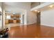 Open living room with kitchen view, wood floors and staircase at 7325 Thoreau Cir, Atlanta, GA 30349
