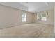 Large main bedroom with a tray ceiling and ample natural light at 7325 Thoreau Cir, Atlanta, GA 30349