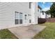 Back patio with a view of the fenced-in backyard and the home's rear exterior at 7325 Thoreau Cir, Atlanta, GA 30349