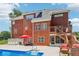 Large back exterior with pool, deck and patio seating at 1424 Brighton, Loganville, GA 30052