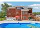View of the back exterior, deck and outdoor pool at 1424 Brighton, Loganville, GA 30052