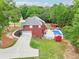 Aerial view highlighting the in-ground pool, patio, and lush landscaping surrounding the property at 1424 Brighton, Loganville, GA 30052