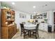 Charming dining area featuring shiplap walls, farmhouse decor, and cozy seating for four at 1424 Brighton, Loganville, GA 30052
