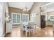 Eat-in kitchen with modern chandelier and views of the outdoors at 1424 Brighton, Loganville, GA 30052