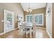Eat-in kitchen with modern chandelier and access to outdoors at 1424 Brighton, Loganville, GA 30052