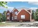 Attractive brick home with manicured front yard and new roof at 1424 Brighton, Loganville, GA 30052