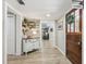 Inviting hallway features modern wood-look floors, decorative accents, and access to the living spaces at 1424 Brighton, Loganville, GA 30052