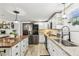 Bright kitchen with granite countertops, stainless steel appliances, and a large island perfect for cooking and entertaining at 1424 Brighton, Loganville, GA 30052