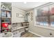 Functional laundry area with shelving, storage space, and a view of the pool at 1424 Brighton, Loganville, GA 30052