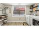 Bright laundry room featuring modern washer/dryer, built-in storage, and view to the outdoor pool at 1424 Brighton, Loganville, GA 30052