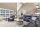 Spacious living room with two-story ceilings and comfortable seating at 1424 Brighton, Loganville, GA 30052