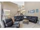 Open-concept living room featuring a fireplace, two-story ceilings, and plush seating at 1424 Brighton, Loganville, GA 30052
