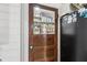Charming pantry door with glass window and wood frame offers a glimpse into organized storage at 1424 Brighton, Loganville, GA 30052