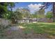 A view of the backyard showing the house and partially screened-in porch at 1909 Cindy Dr, Decatur, GA 30032
