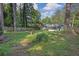 Expansive backyard bordered by a wooden fence and mature trees at 1909 Cindy Dr, Decatur, GA 30032