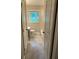 Neutral bathroom featuring a window, bath/shower, toilet, vanity and tile flooring at 1909 Cindy Dr, Decatur, GA 30032