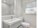 The renovated bathroom features a large vanity, updated fixtures, and a window at 1909 Cindy Dr, Decatur, GA 30032