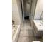 Neutral bathroom featuring a tub/shower with tile surround, vanity sink, toilet and tile flooring at 1909 Cindy Dr, Decatur, GA 30032