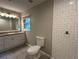 Bathroom featuring granite countertops and tiled walk-in shower at 1909 Cindy Dr, Decatur, GA 30032