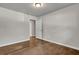 This bedroom features hardwood floors, neutral paint, and a ceiling light at 1909 Cindy Dr, Decatur, GA 30032