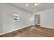 This bedroom features wood-look flooring, neutral paint, and lots of natural light at 1909 Cindy Dr, Decatur, GA 30032