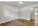 This bedroom features a large closet, hardwood floors, neutral walls, and a ceiling light at 1909 Cindy Dr, Decatur, GA 30032