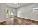 This bedroom has hardwood floors, neutral paint, and lots of natural light at 1909 Cindy Dr, Decatur, GA 30032