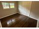 Bedroom with hardwood floors, window, and closet at 1909 Cindy Dr, Decatur, GA 30032