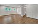 Bedroom with wood floors, two windows, closet, and white trim for natural lighting at 1909 Cindy Dr, Decatur, GA 30032
