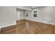 A bright bedroom with wood floors, complemented by white trim, offers a view into an attached bathroom at 1909 Cindy Dr, Decatur, GA 30032