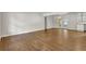 Dining area with wood floors, connected to the kitchen, with doors to the patio and built-in shelves at 1909 Cindy Dr, Decatur, GA 30032