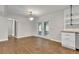 Dining area with wood floors, open to the kitchen, with a sliding barn door and French doors to the patio at 1909 Cindy Dr, Decatur, GA 30032