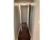 Hallway with hardwood floors and a sliding barn door at 1909 Cindy Dr, Decatur, GA 30032