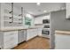 Modern kitchen features stainless steel appliances, white cabinets, and open shelving at 1909 Cindy Dr, Decatur, GA 30032