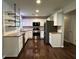 Spacious kitchen with stainless steel appliances and dark hardwood floors at 1909 Cindy Dr, Decatur, GA 30032