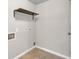 The laundry room features a shelf for storage at 1909 Cindy Dr, Decatur, GA 30032