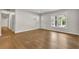 Bright living room featuring hardwood floors, white walls, and natural light from the window at 1909 Cindy Dr, Decatur, GA 30032