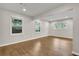 A bright living room with wood floors and plenty of natural light from the multiple windows at 1909 Cindy Dr, Decatur, GA 30032