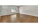Bright living room featuring a large window, hardwood floors, and neutral paint at 1909 Cindy Dr, Decatur, GA 30032