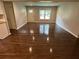 Open-concept living room with hardwood floors and plenty of natural light at 1909 Cindy Dr, Decatur, GA 30032