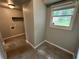 Mud room with tile floors, window and gray colored walls at 1909 Cindy Dr, Decatur, GA 30032