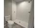 Updated shower with white subway tile and tile floor at 1909 Cindy Dr, Decatur, GA 30032