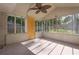 Large sunroom with screened windows and light gray floors at 1909 Cindy Dr, Decatur, GA 30032